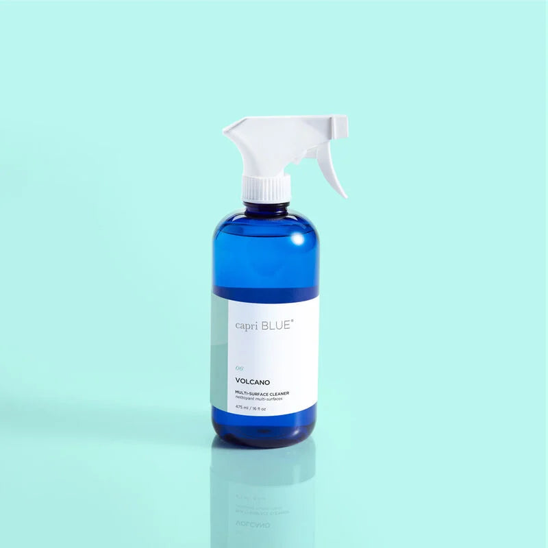 Blue multi-surface cleaner bottle with white label and trigger sprayer