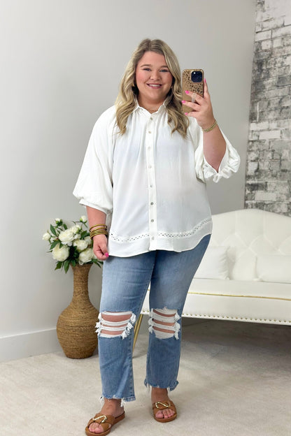 Off white top with voluminous gathered sleeves