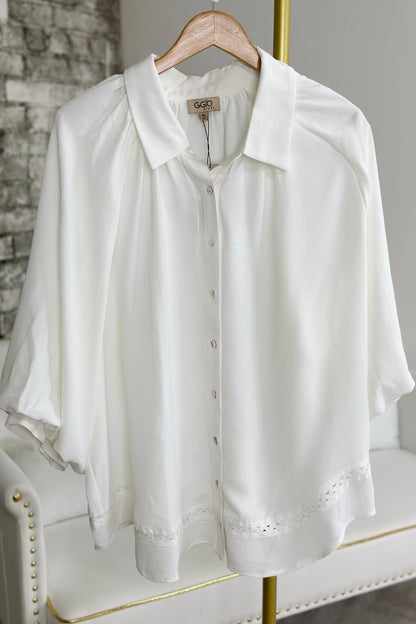 Off white blouse with full billowing sleeves