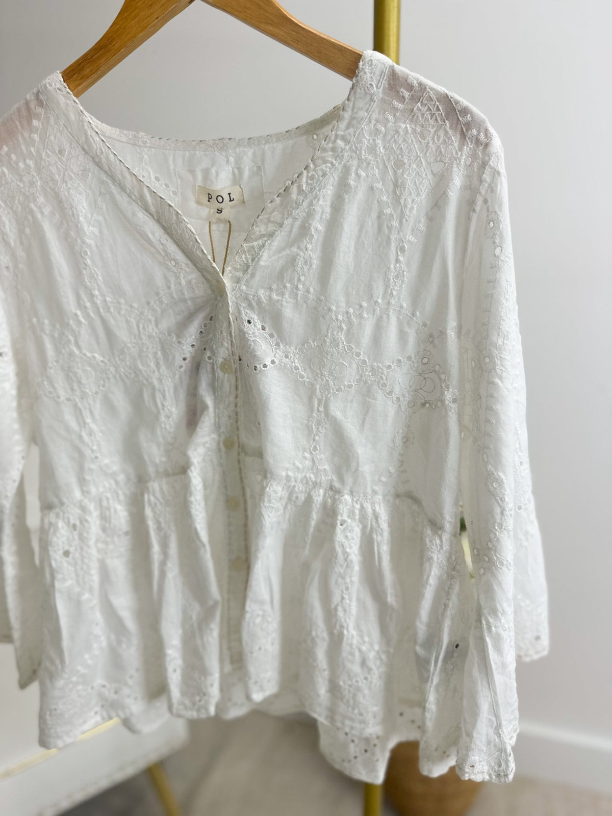 Eyelet detail top in a crisp off white