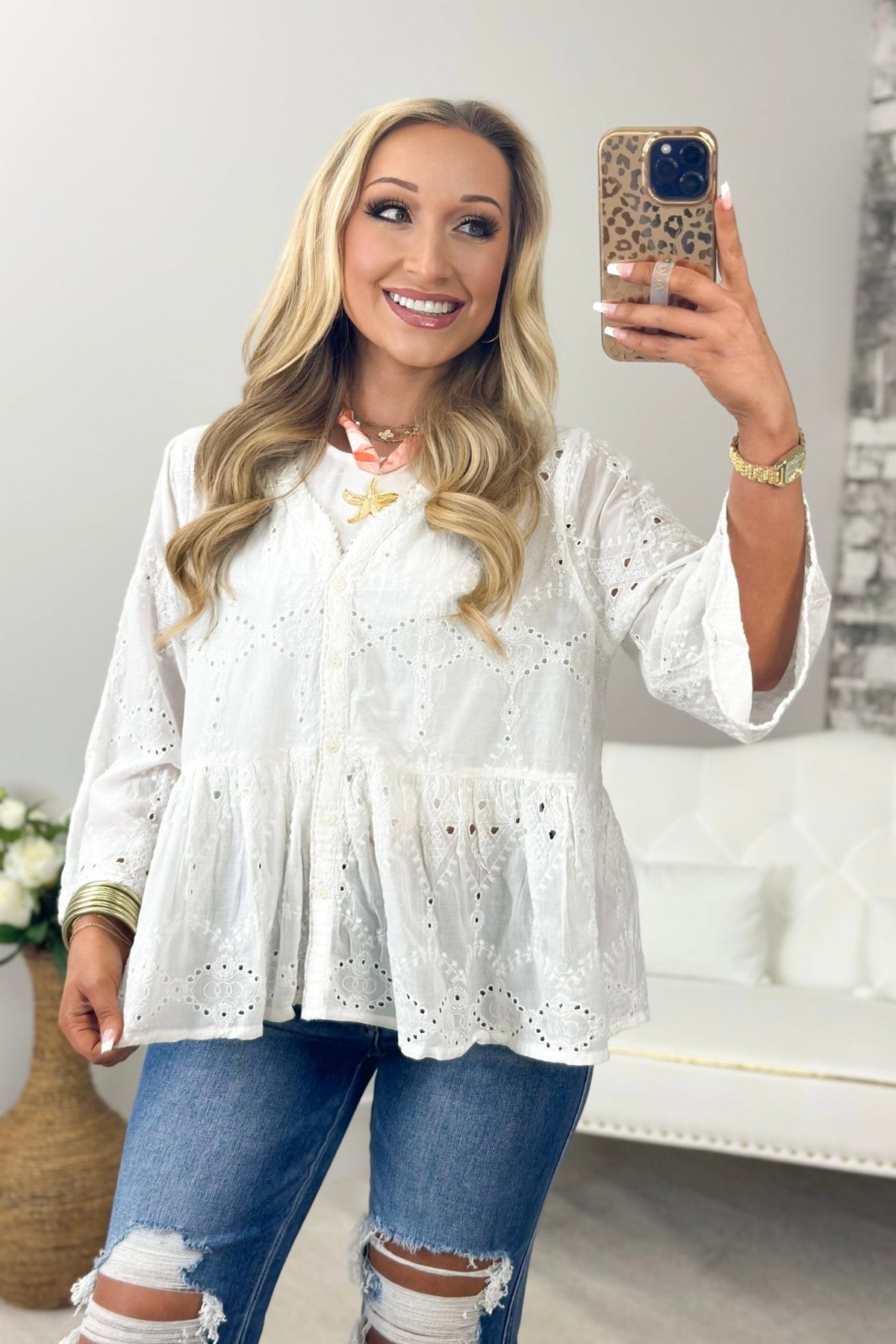 Off white eyelet top with a button front