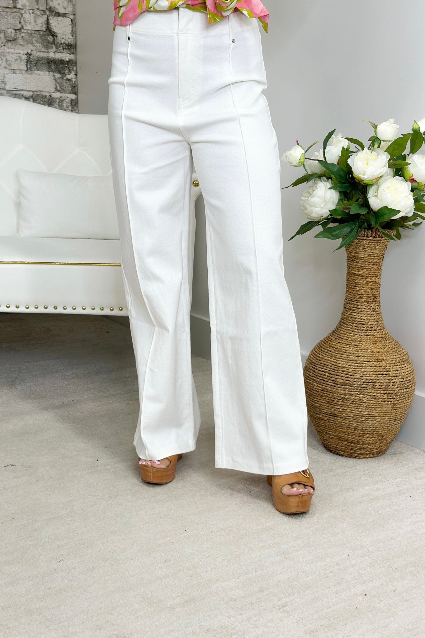 Off white wide leg trousers with a centre front seam