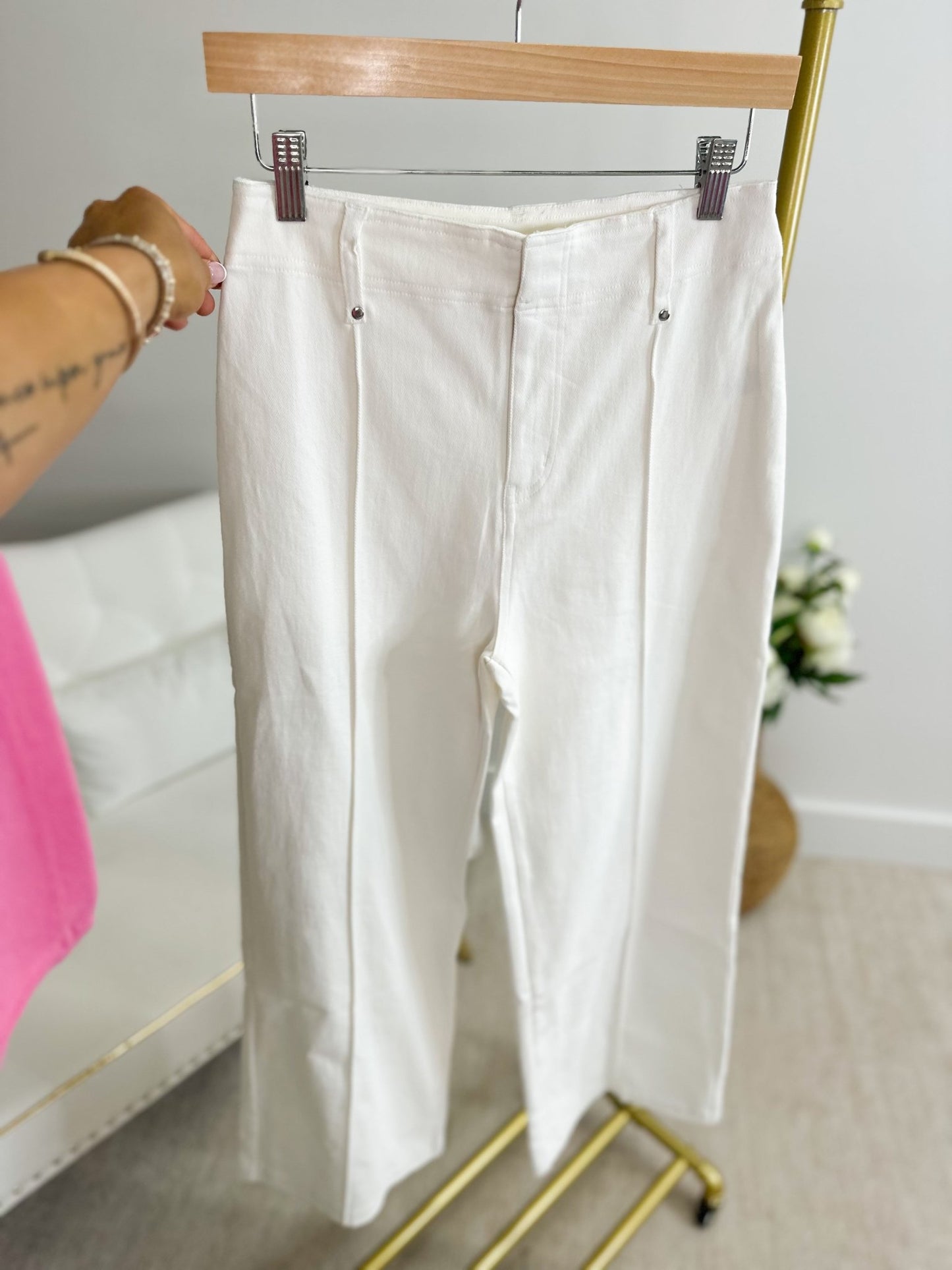 Off white wide leg pants with a crease front and clean waistband