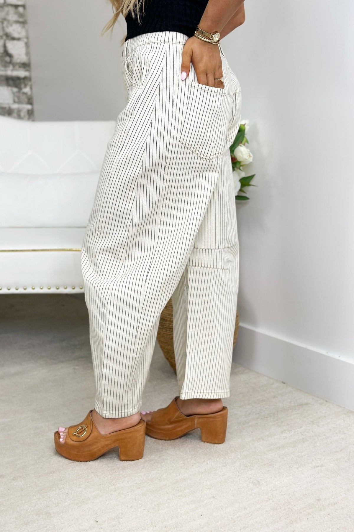 Cream stripe barrel pants with a high waist