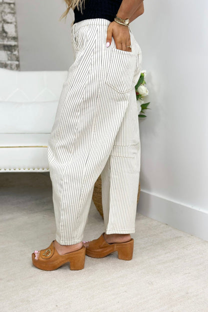 Cream stripe barrel pants with a high waist