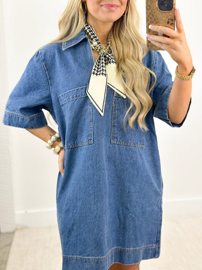 V-neck denim dress in a mid-wash blue
