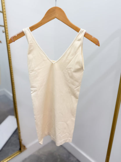 Sleeveless tank with scoop and v-neck sides