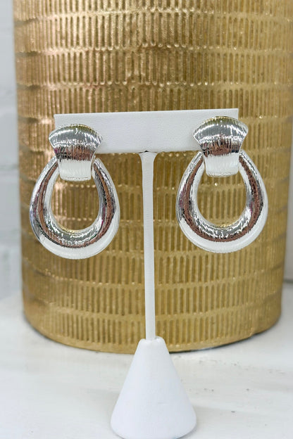 Door knocker earrings with a textured metal finish