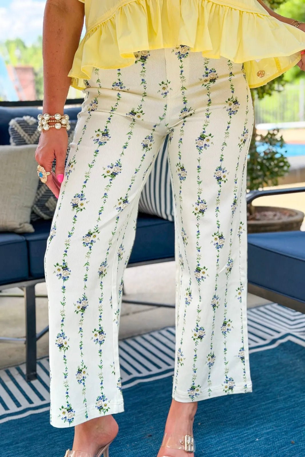 Cream wide leg floral pants with a straight hem