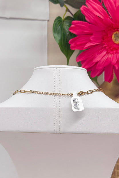 Gold chain necklace with elongated pearl stations