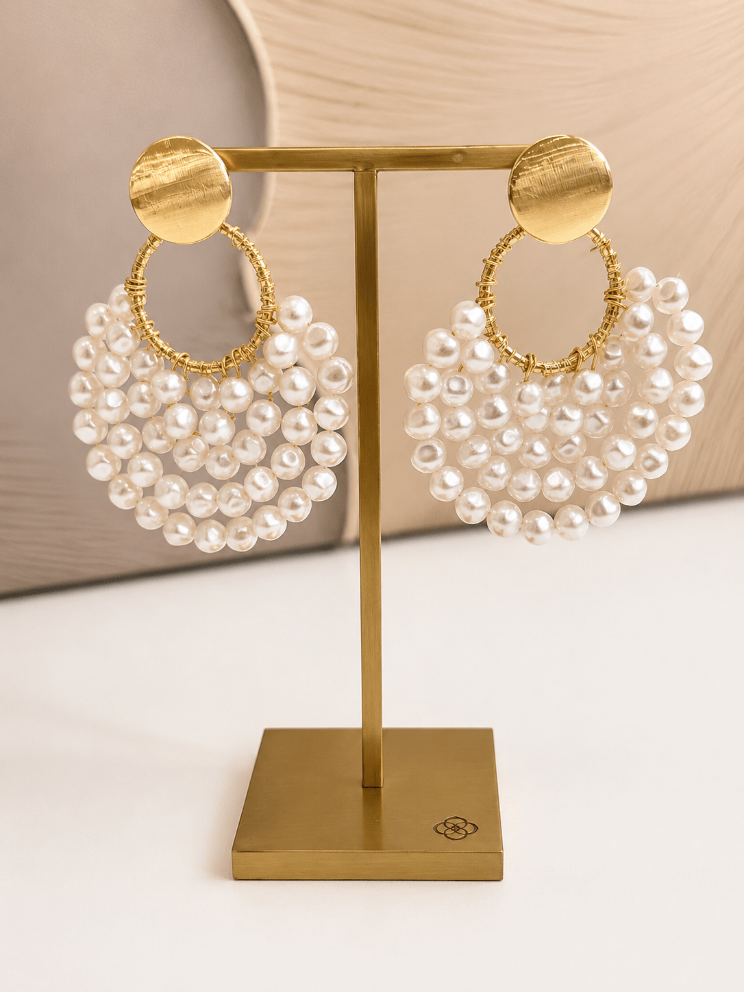 Cream pearl crescent drop earrings in gold
