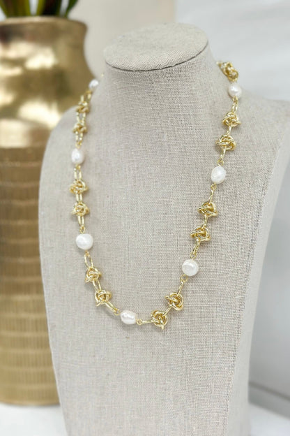Knotted pearl strand necklace