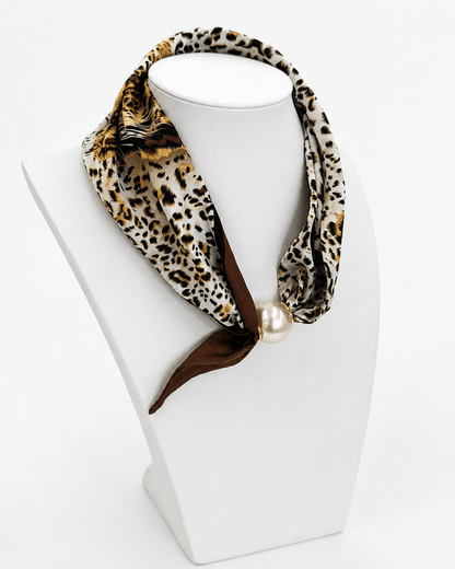 Pearl strand necklace threaded with leopard print fabric