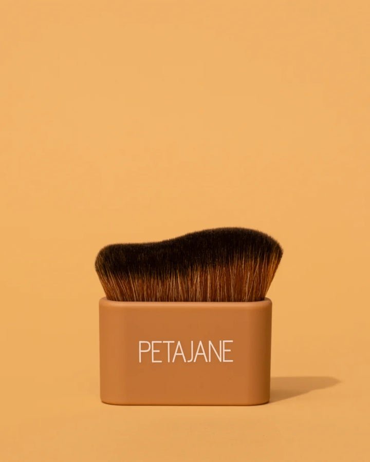 Body perfecting brush for blending self tanner