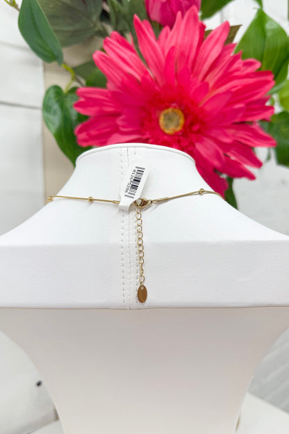 Oval opal necklace with a gold bezel