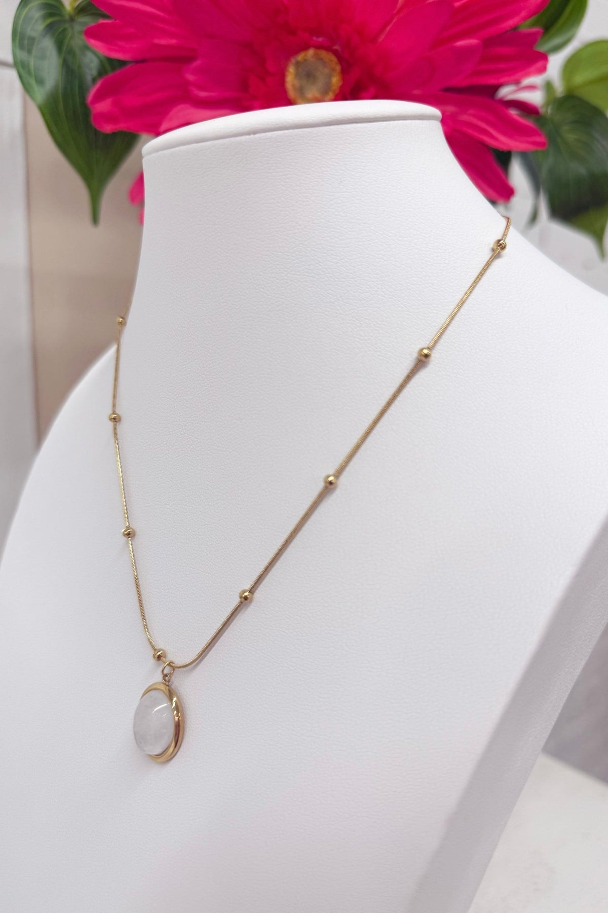 Iridescent opal pendant on a fine gold chain