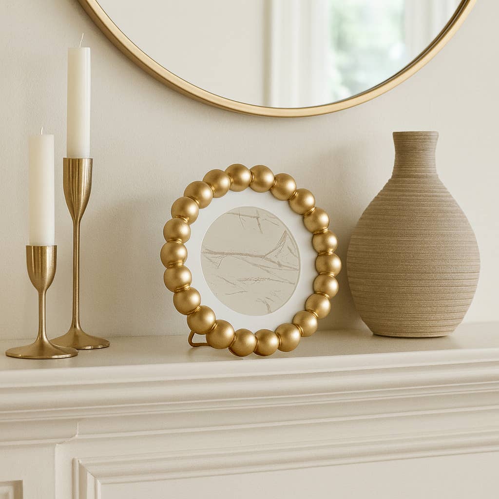 Beaded gold picture frame with a matted 6x6 glass opening