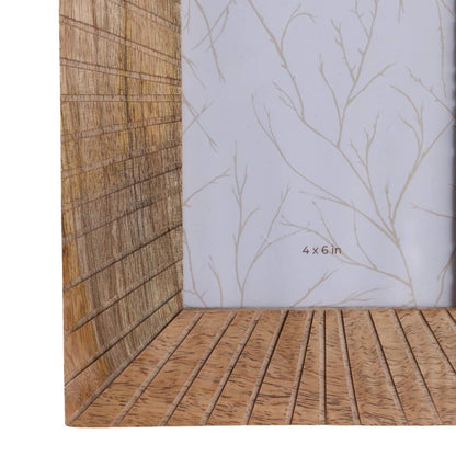 Wooden picture frame with a starburst pattern in natural tones