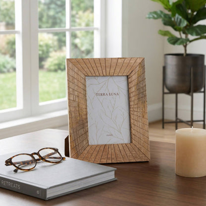 Natural wood frame with rays radiating from a 4x6 opening