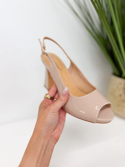 Nude slingback pump with an open back strap