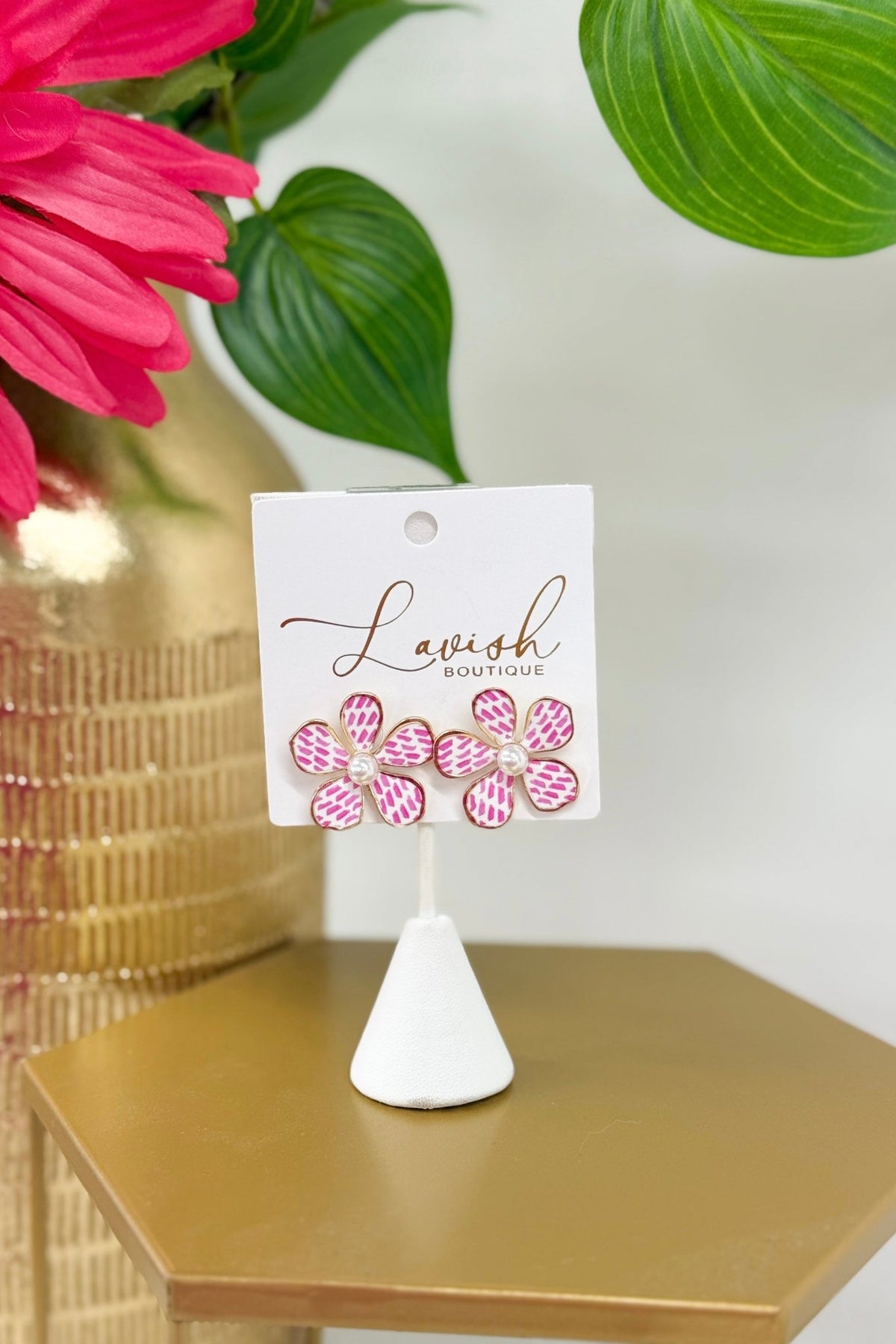 Flower-shaped earrings in a pink printed pattern