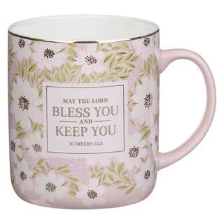 Pink floral design lettered Bless You And Keep You