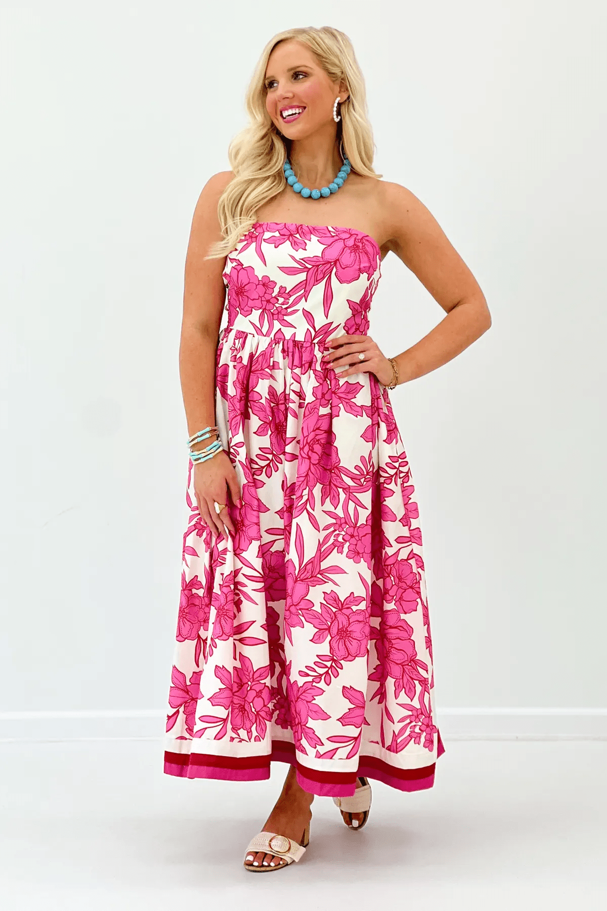 Strapless cotton midi dress in a bold pink floral print