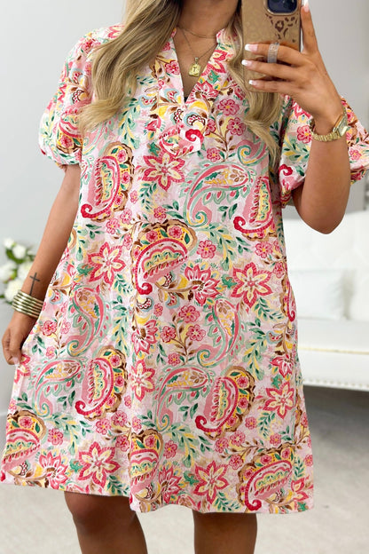 Pink toned abstract print dress with a fluid drape