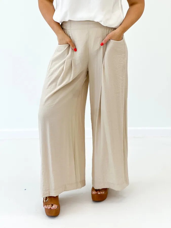 Tan wide leg pants with front pleat detail