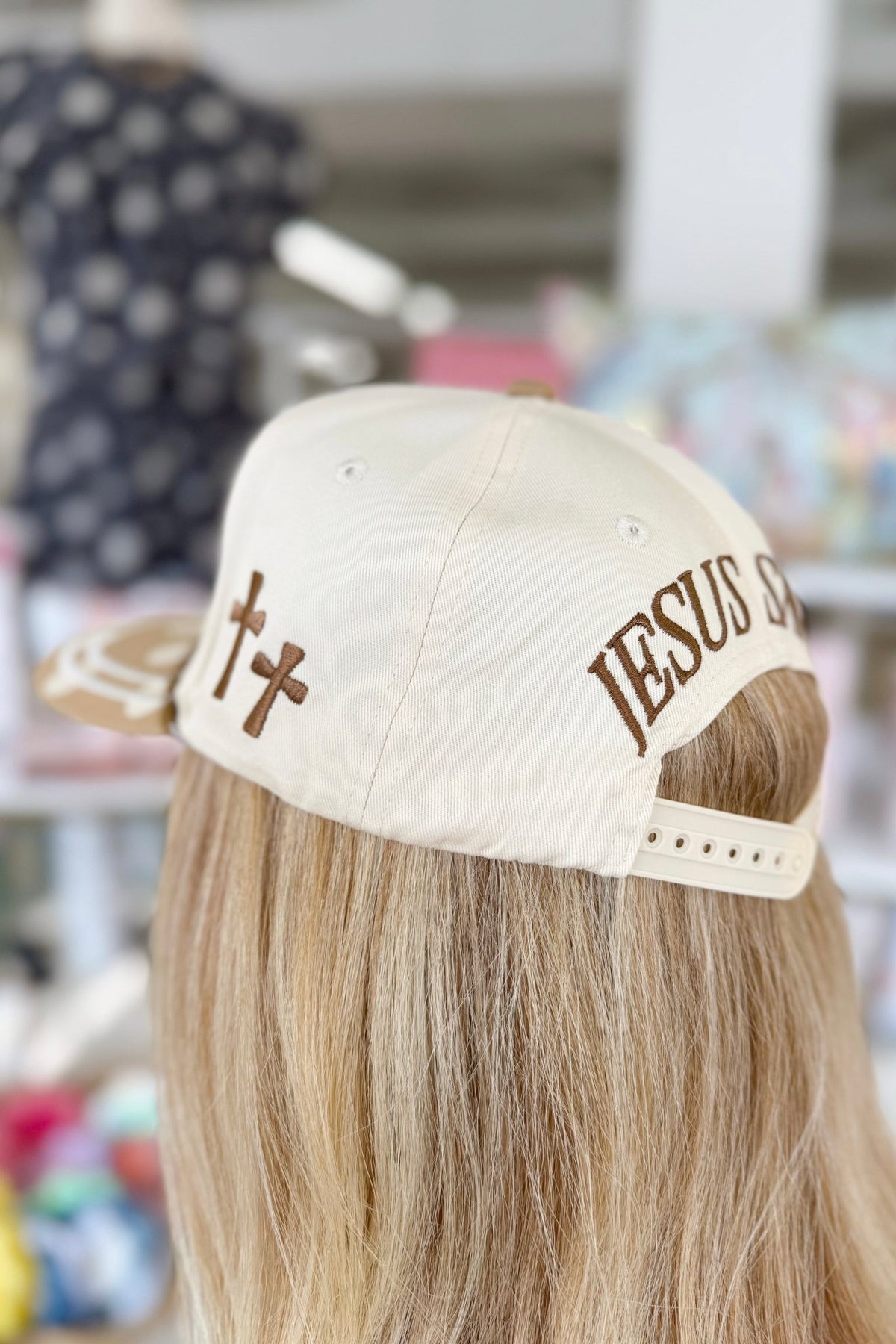 Polka dot patterned hat with front text detail