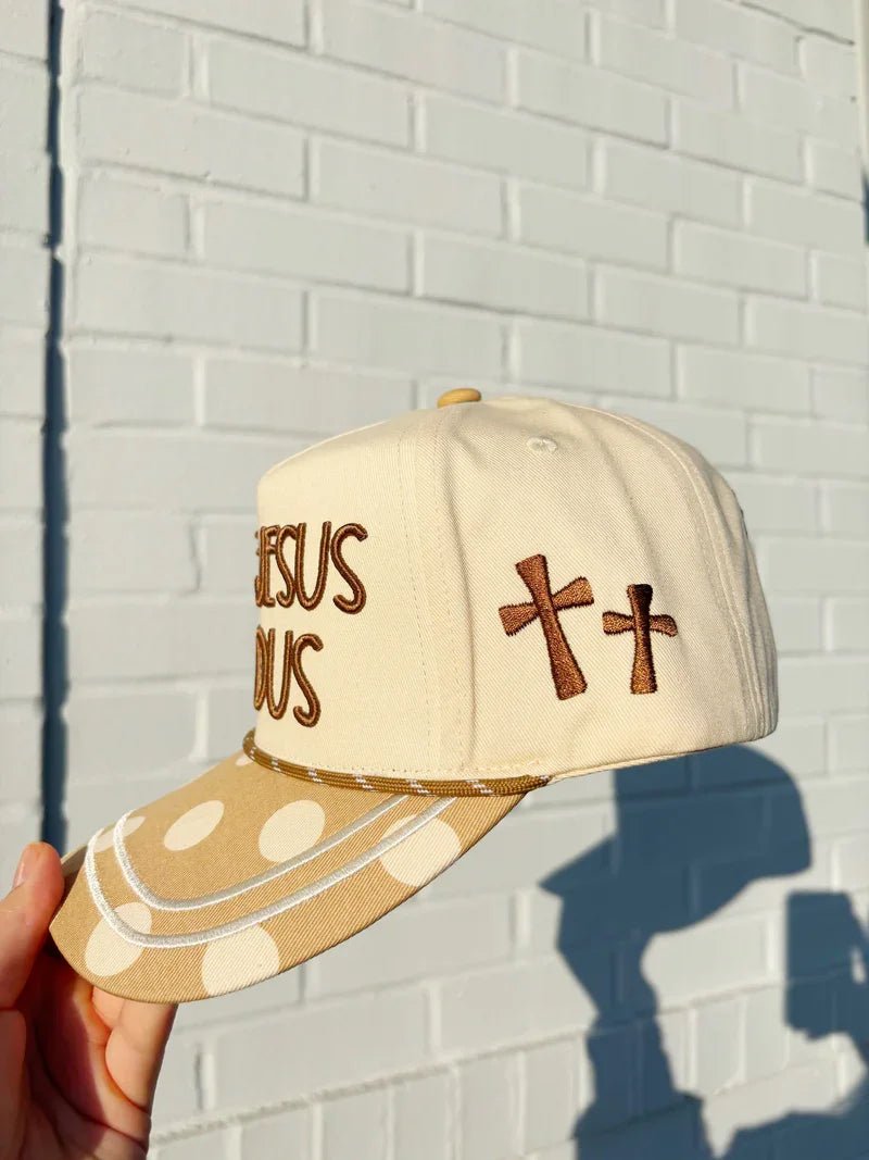 Polka dot cap with Make Jesus Famous wording on the front