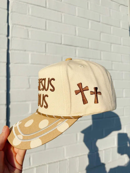 Polka dot cap with Make Jesus Famous wording on the front