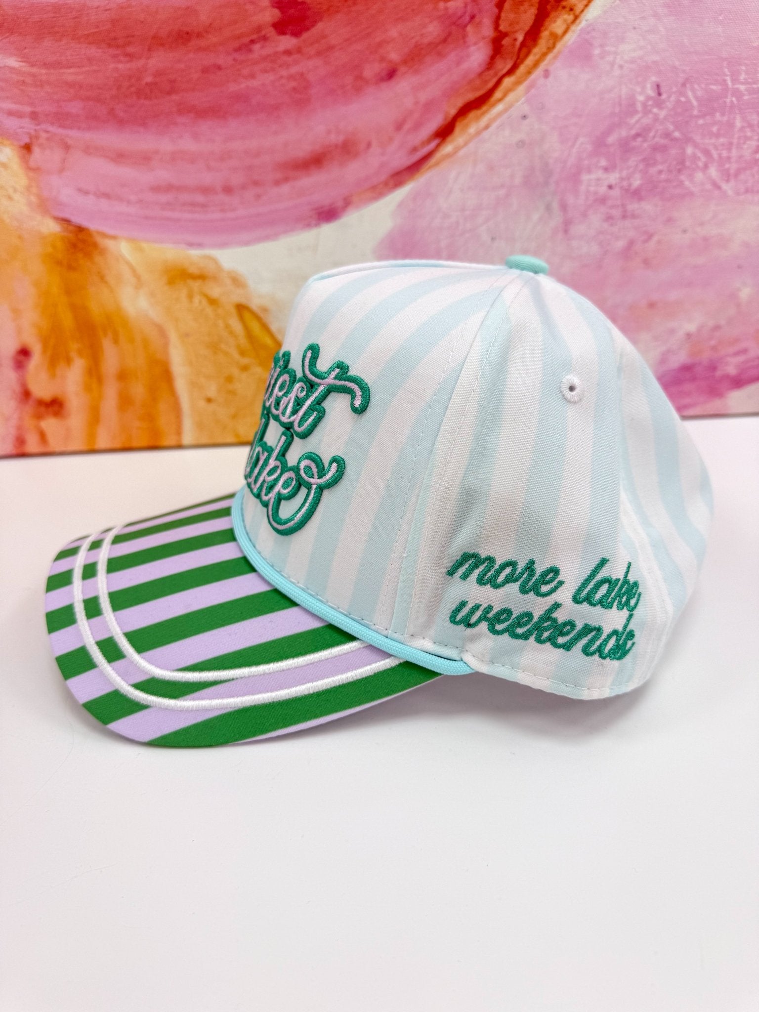 Multicolour lake-themed cap with Happiest at the Lake wording