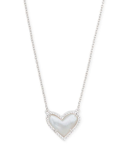 Rhodium heart pendant necklace with ivory mother-of-pearl center and clear accents