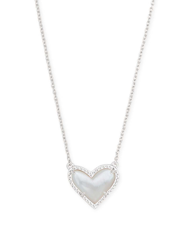Rhodium heart pendant necklace with ivory mother-of-pearl center and clear accents