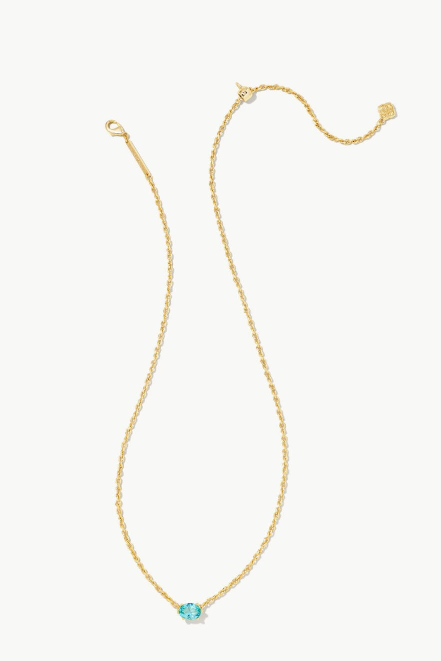 Gold pendant necklace with round aqua crystal at center, delicate chain
