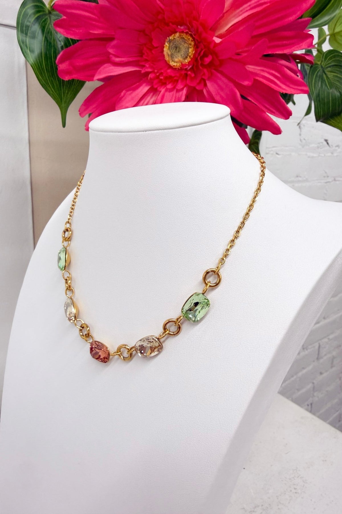 Rainbow gemstone necklace in a gold-tone setting