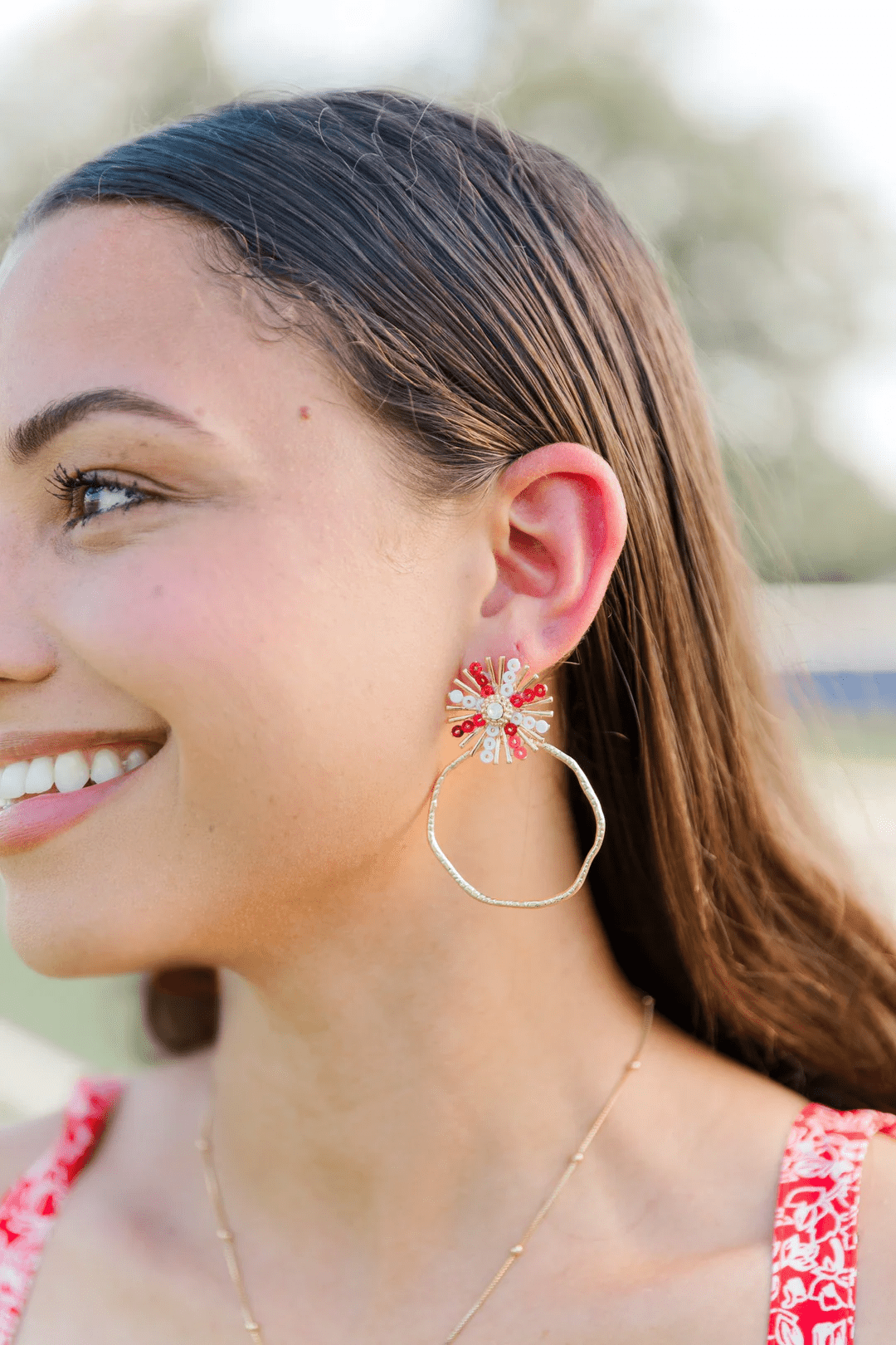 Red and white sequin sunburst hoop earrings