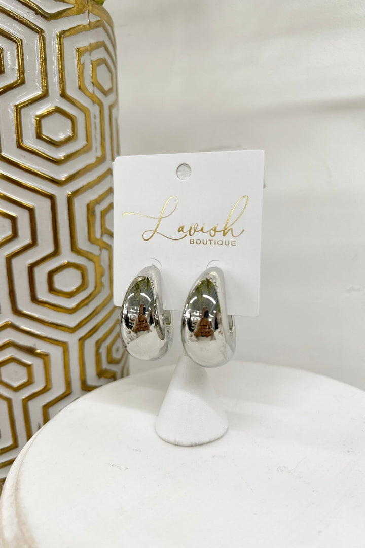 Rhodium hoop earrings with a gradually thickening band