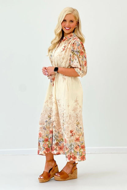 Collared V-neck on a botanical print midi dress with side pockets