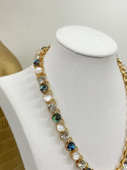 Multi-stone necklace with evenly spaced round stones