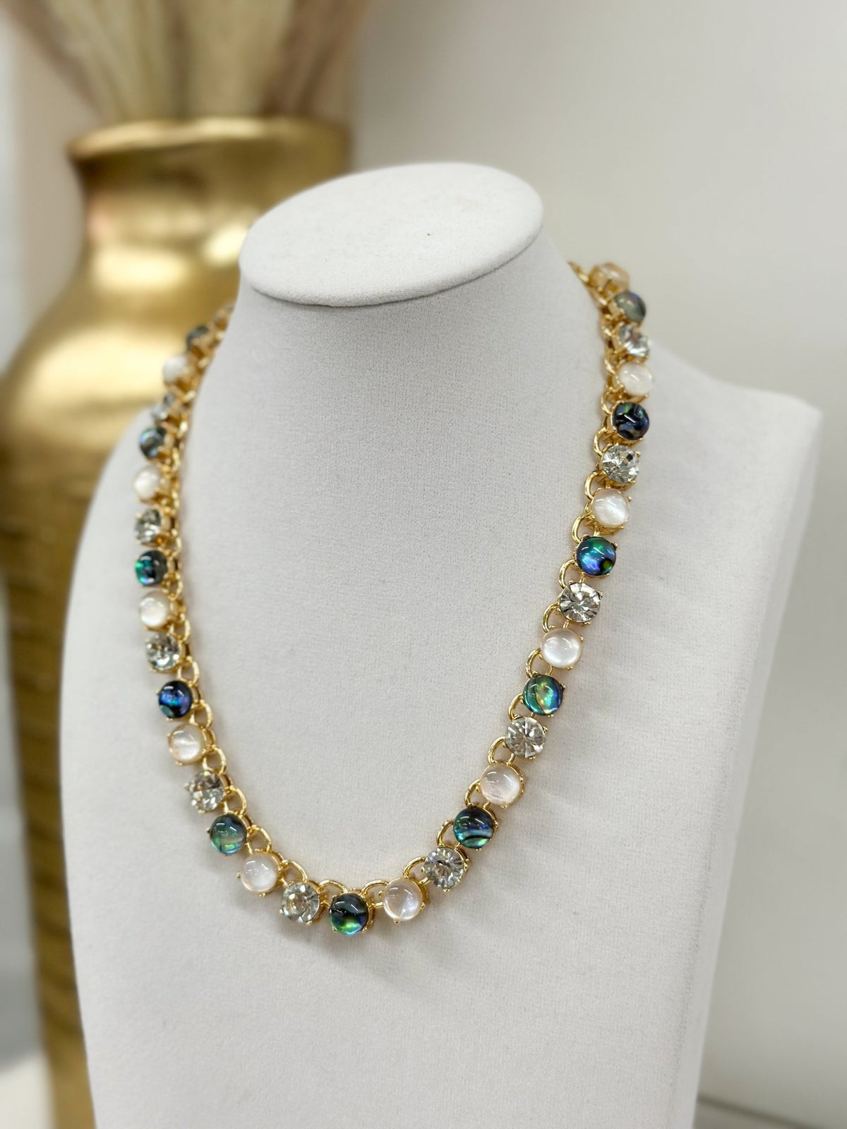 Necklace strung with round stones in mixed colors