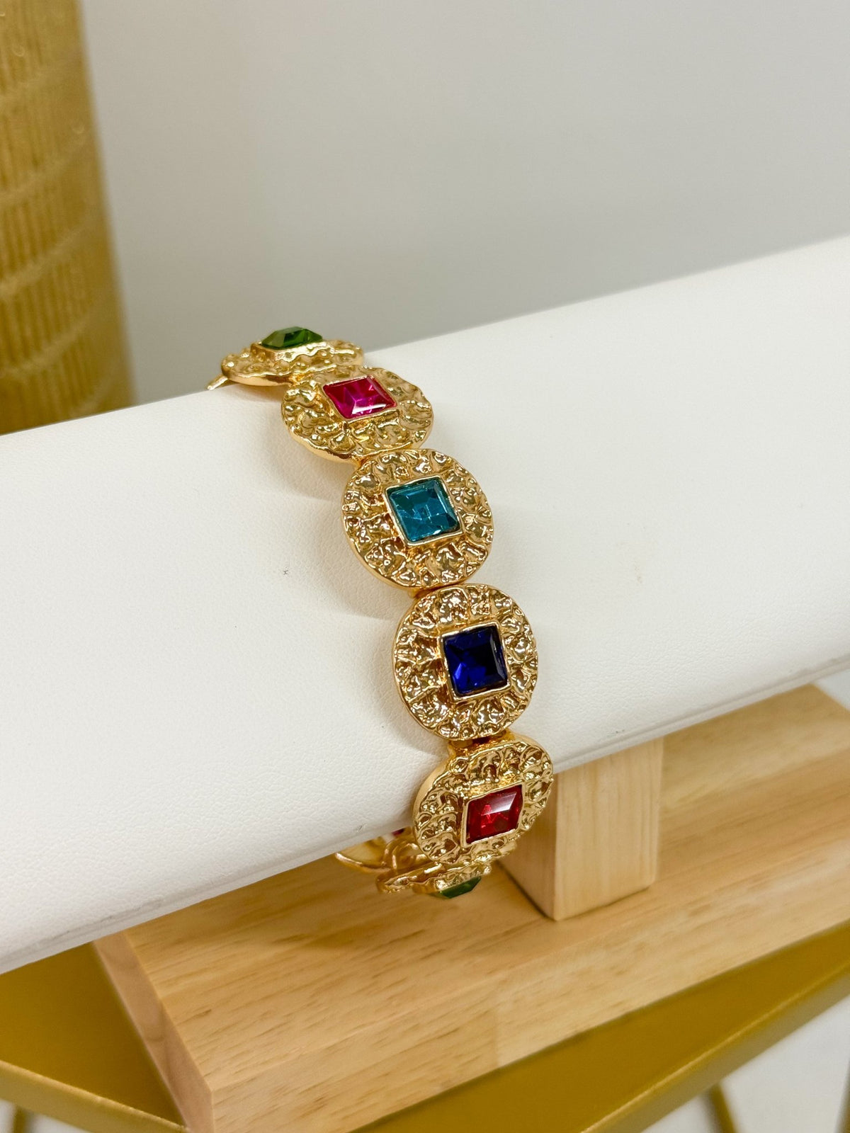 Round bead bracelet accented with square stones