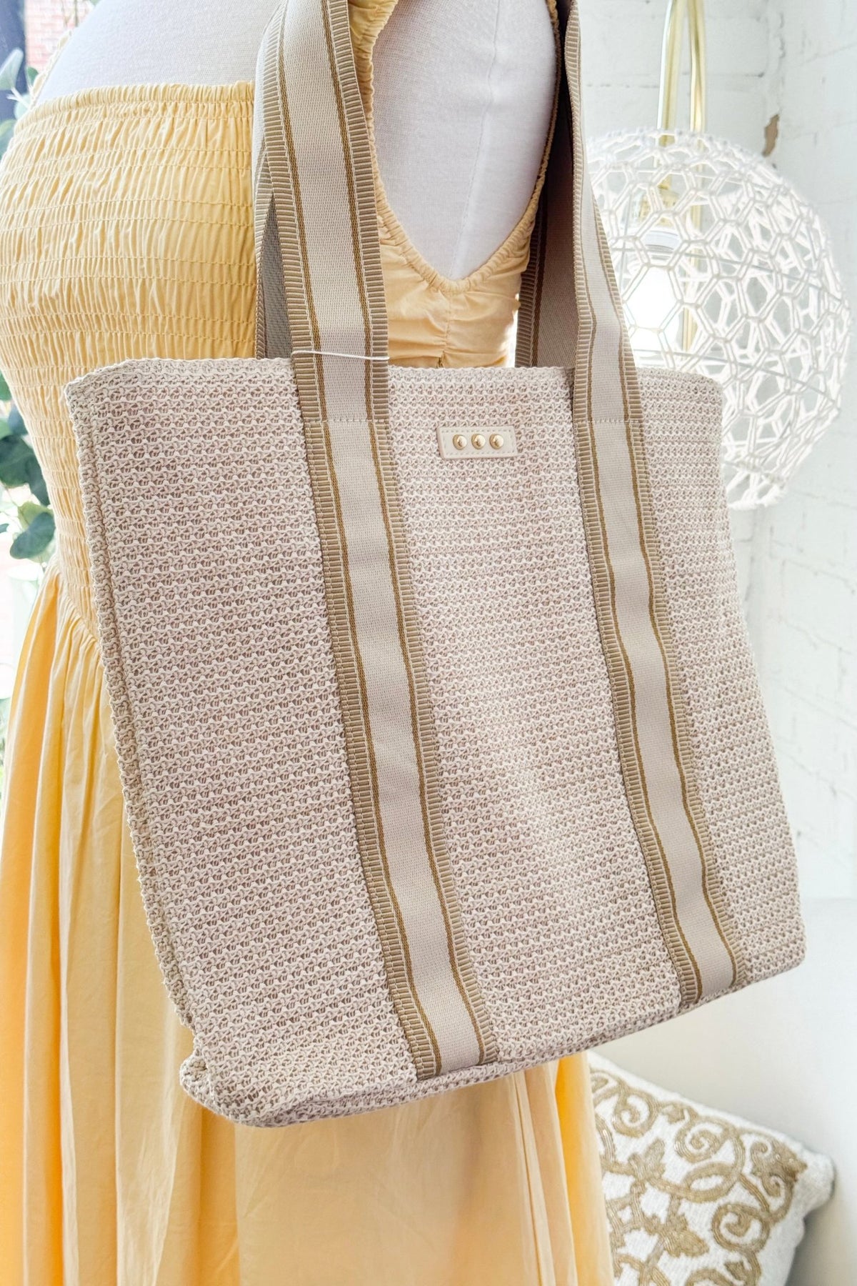 Cream raffia tote bag with a woven texture