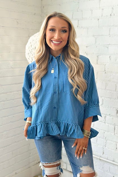 Button down top with a ruffled hem
