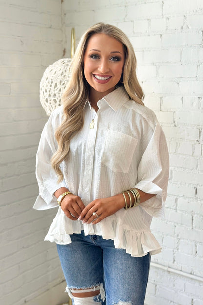 Collared button down with a ruffle trimmed bottom