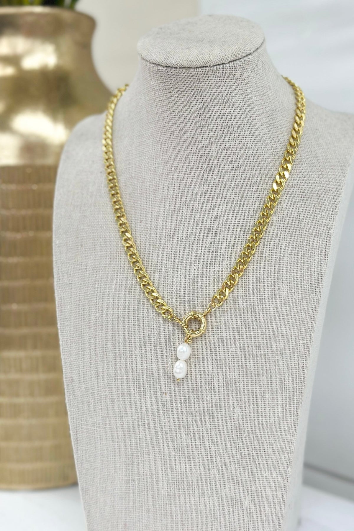 Fine gold necklace with a small charm