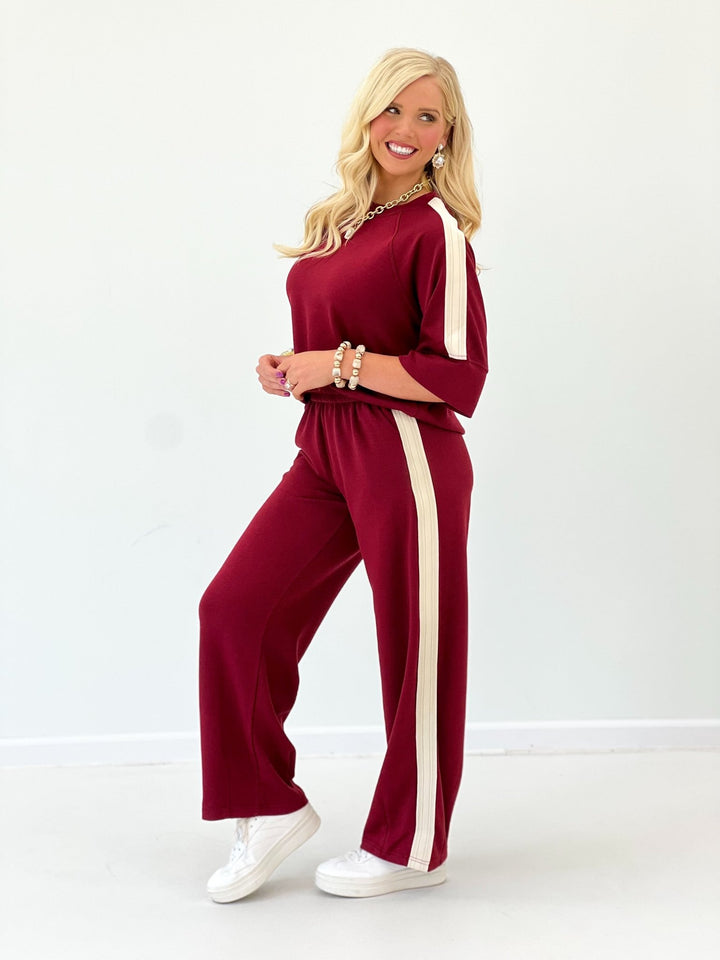 Wine scuba-knit pant set with loose top and wide-leg pants, tall side stripe panels