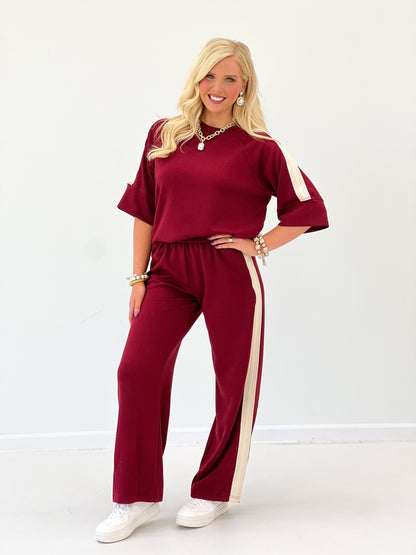 Wine scuba-knit pant set with short-sleeve loose top and wide-leg pants, white side stripes