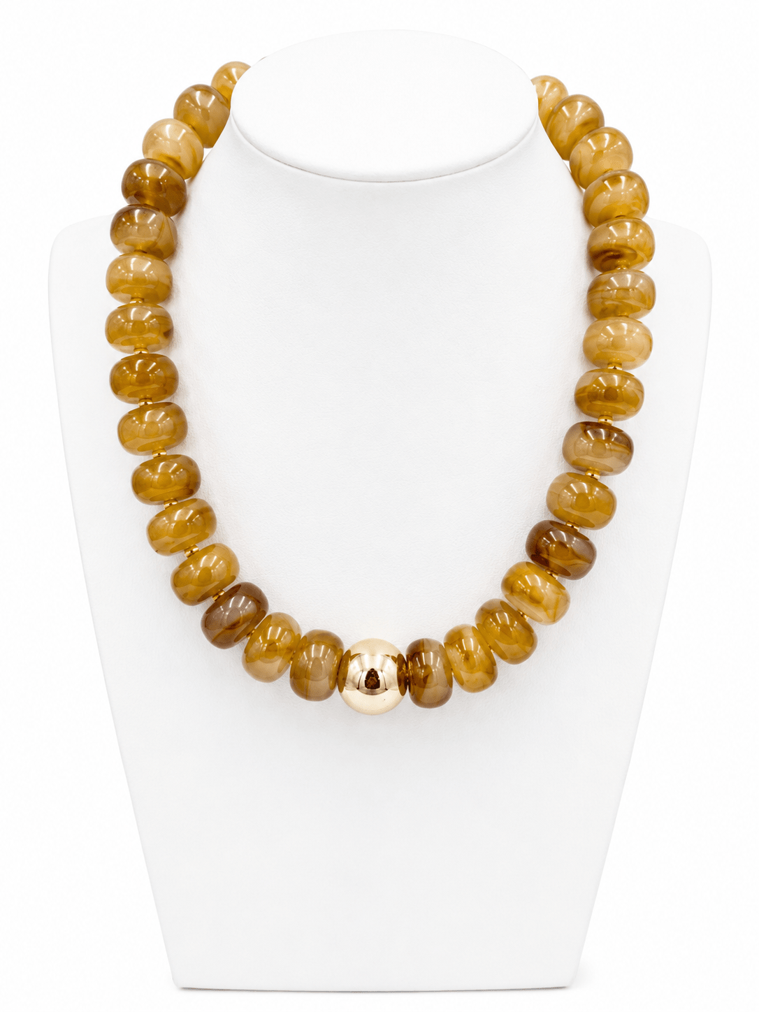 Gold accented bead necklace in earthy tones